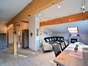 a living room with a dining table and a couch at Holiday apartment with 2 bedrooms in Vorderburg