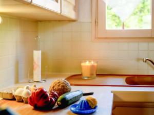 a kitchen counter with vegetables on a cutting board at in southern France La Bastide in Saint-Julien-de-Peyrolas +20 photos