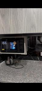 a microwave oven sitting on top of a kitchen counter at غرفة فندقية in Hurghada