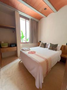 a bedroom with a large bed with a large window at Casa Xaviera in Puerto Escondido +94 photos