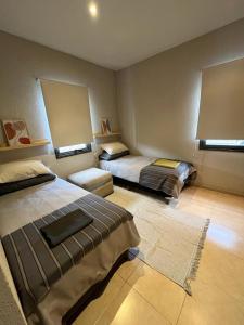a room with two beds in a room at Rincón de Chacras de Coria in Ciudad Lujan de Cuyo +13 photos