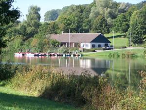 a house with a bunch of boats in the water at Holiday apartment with 2 bedrooms in Eggenthal