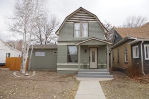a house with a green and brown house at Luxurious Renovated Gem in Convenient Location! in Delta