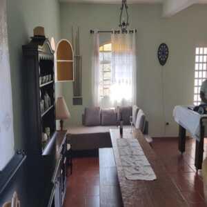a living room with a couch and a table at WJL Sitio Silva in Ibiúna