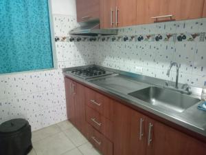 Η κουζίνα ή μικρή κουζίνα στο Hospedaje en apartamento 2