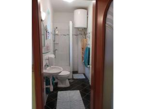 a bathroom with a toilet and a sink at Müller's holiday home Waldhof in Döbrököz Vasútállomás