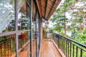 a balcony of a house with a view of the water at S79 Residences Khai Ngoc Dalat in Da Lat
