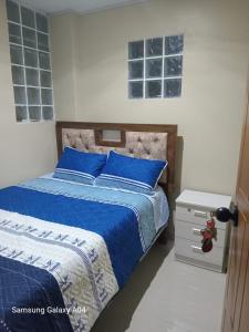 Una cama o camas en una habitación de Hospedaje TITANIC