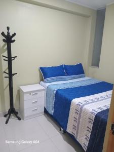 Una cama o camas en una habitación de Hospedaje TITANIC