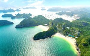 an aerial view of a beach in the water at Cát Bà Swiss Hotel in Cat Ba
