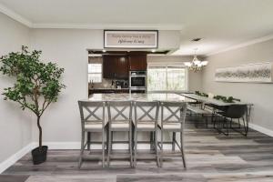 a kitchen and dining room with a table and chairs at 4-BR Family Retreat in Quiet Conroe Neighborhood in Conroe +20 photos