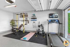 a gym with two treadmills and a treadmill at Inviting Home with Mountain Views & Pool-Spa in San Diego
