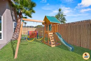 a playground with a slide and a play structure at Inviting Home with Mountain Views & Pool-Spa in San Diego