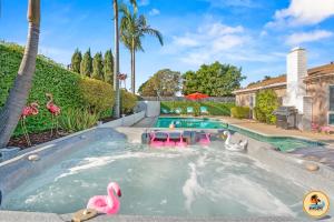 a swimming pool with a pool noodle bar in a backyard at Inviting Home with Mountain Views & Pool-Spa in San Diego