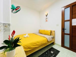 Un pat sau paturi într-o cameră la Hà An Homestay Nguyên Căn