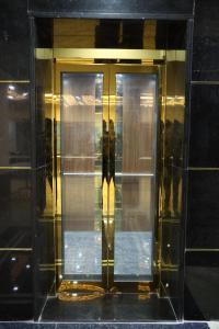 a glass elevator door in a building at pvp inn in Ārani +12 photos