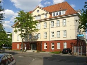 a large building on the corner of a street at Hotel Brühlerhöhe in Erfurt