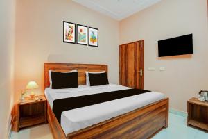 En eller flere senge i et værelse på Hotel O Green City Dhakoli Formerly Swagat + 21 billeder