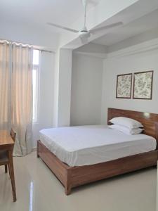 Postel nebo postele na pokoji v ubytování La Vita Oasis