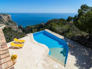 a swimming pool with a view of the ocean at Villa with Sea Breeze Charm in Cumbre del Sol