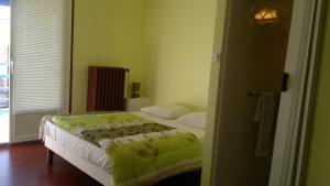 Ambre Hotelにあるベッド