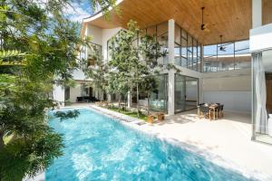 an image of a house with a swimming pool at The Trinity C4 new modern 5BR villa with 20M Pool in Ban Pak Lak