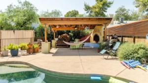 a backyard with a playground and a slide at Central House with Pool & Hot Tub in Tucson