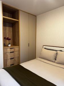 Ένα ή περισσότερα κρεβάτια σε δωμάτιο στο Loft Americana Chapultepec Alberca Wifi AC +19 φωτογραφίες