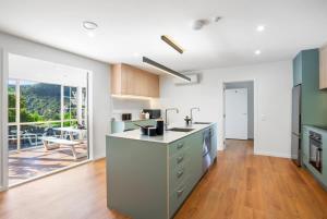a kitchen with a sink and a counter top at Twin Room at Wolfe Street in Whangarei