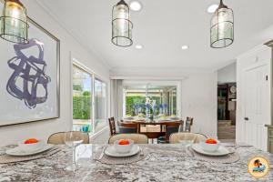 a dining room with a table with chairs and a dining room at Cozy Tierrasanta Escape-4BR, Pool, Firepit, Games! in San Diego