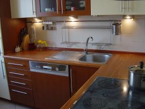 a kitchen with a sink and a stove top oven at Bogusławskiego 18 in Warsaw +10 photos