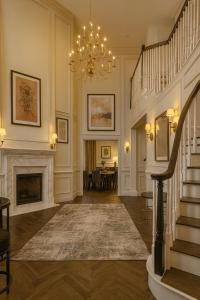 a living room with a staircase and a fireplace at Chic Santa Monica House - Spa Hot Tub, Billiards, BBQ, Projector in Los Angeles