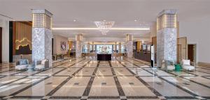a lobby with chairs and a reception desk in a building at Kempinski Hotel & Resort Sariya Yanbu Red Sea in Yanbu +195 photos