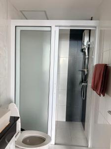 a bathroom with a shower and a toilet at SHaCk Place 87 in Ban Puk (2)