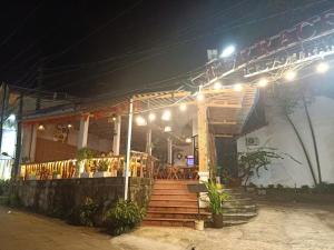a restaurant with a bunch of lights on it at night at Terrace Resort Phú Quốc in Phu Quoc +27 photos
