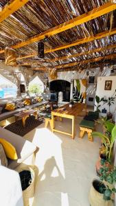 a living room with a couch and a table at Nebro Nubian Guest House - Adults Only in Aswan