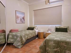 Postel nebo postele na pokoji v ubytování Sunset Apartments - 2 brm 2 bth Darwin City