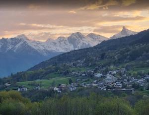a town in a valley with mountains in the background at Casa Indipendente Val d'Ayas - Challand Saint Anselme in Challand Saint Anselme
