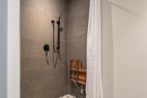 a bathroom with a shower with a shower curtain at Argent at Deer Valley Resort - Hotel Room #105B Hotel Room in Park City