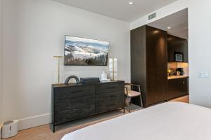 a bedroom with a bed and a dresser at Argent at Deer Valley Resort - Hotel Room #105A Hotel Room in Park City