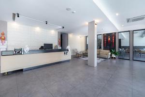 a lobby with a reception desk in a building at Z8 beach hotel in Jomtien Beach