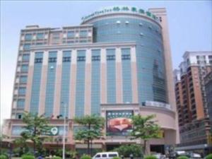 a large building with a sign in front of it at GreenTree Inn GuangDong DongGuan HouJie Business Hotel in Dongguan