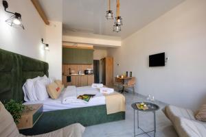 a living room with a bed and a couch at Studio KeyGo #0058 near the Ararat Museum in Yerevan +9 photos