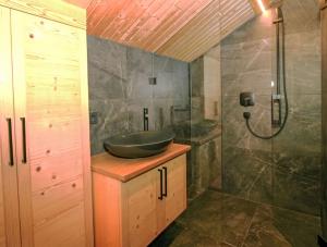 a bathroom with a sink and a shower at Data Castle in Kaltenbach +31 photos