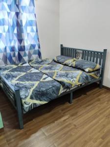 Ένα ή περισσότερα κρεβάτια σε δωμάτιο στο Homestay Teratak D'Desa