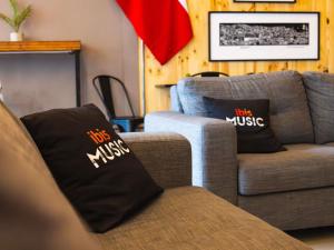 a living room with two couches and two pillows at ibis Valparaiso in Valparaíso +106 photos