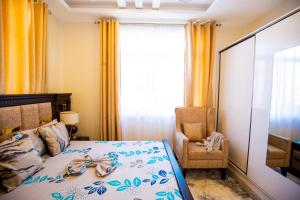 Ένα ή περισσότερα κρεβάτια σε δωμάτιο στο Hamidu City Park