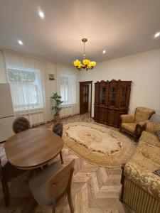 a living room with a table and a couch at Borytchyw in Kyiv