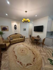 a living room with a couch and a table at Borytchyw in Kyiv