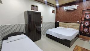 Postel nebo postele na pokoji v ubytování Prem Garden & Resort + 4 fotografie